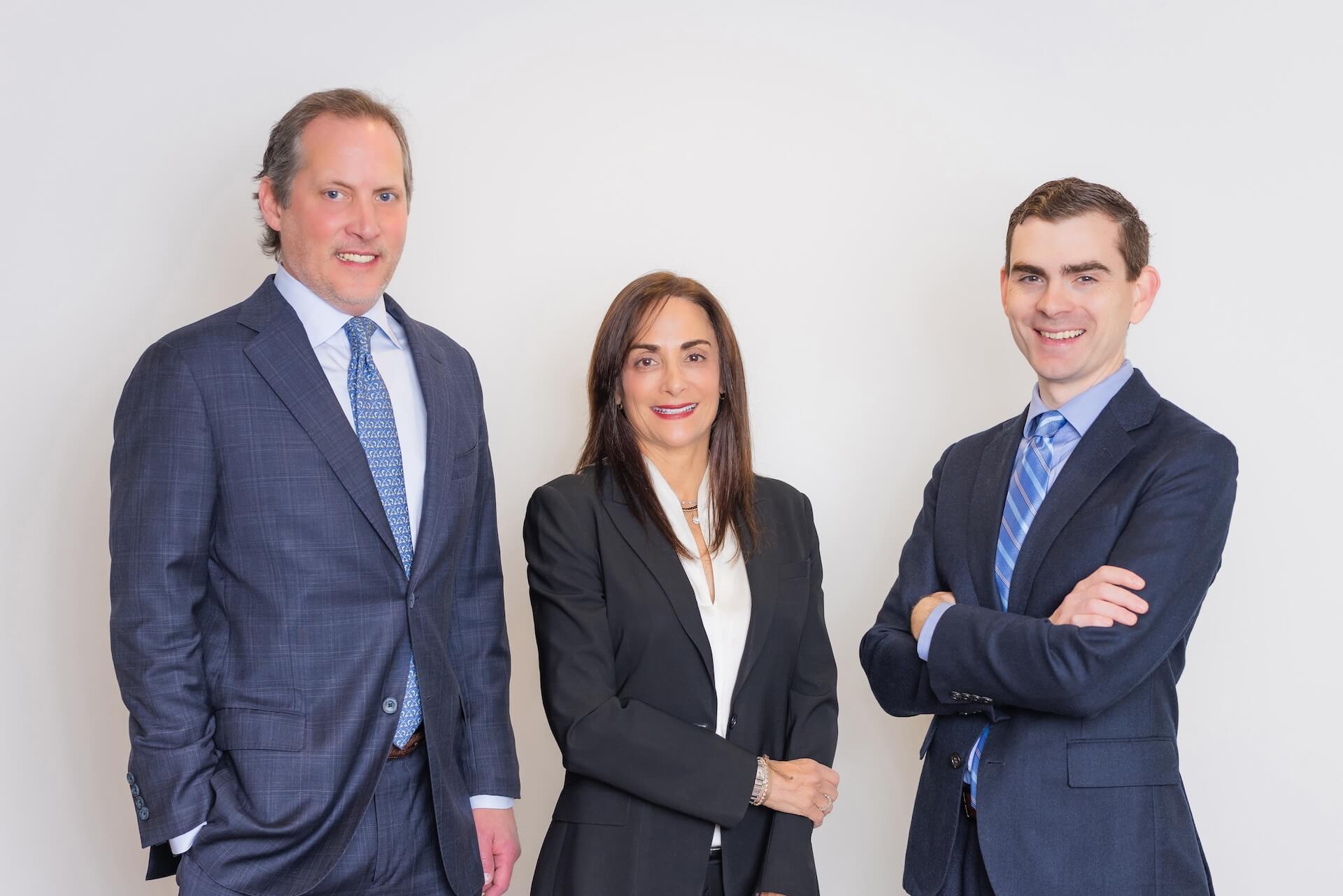 Group photo of three Stern Edlin Graham attorneys standing together