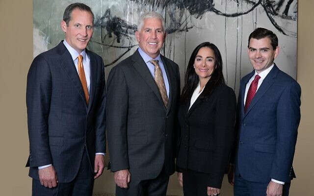 Group photo of four Stern Edlin Graham attorneys standing together