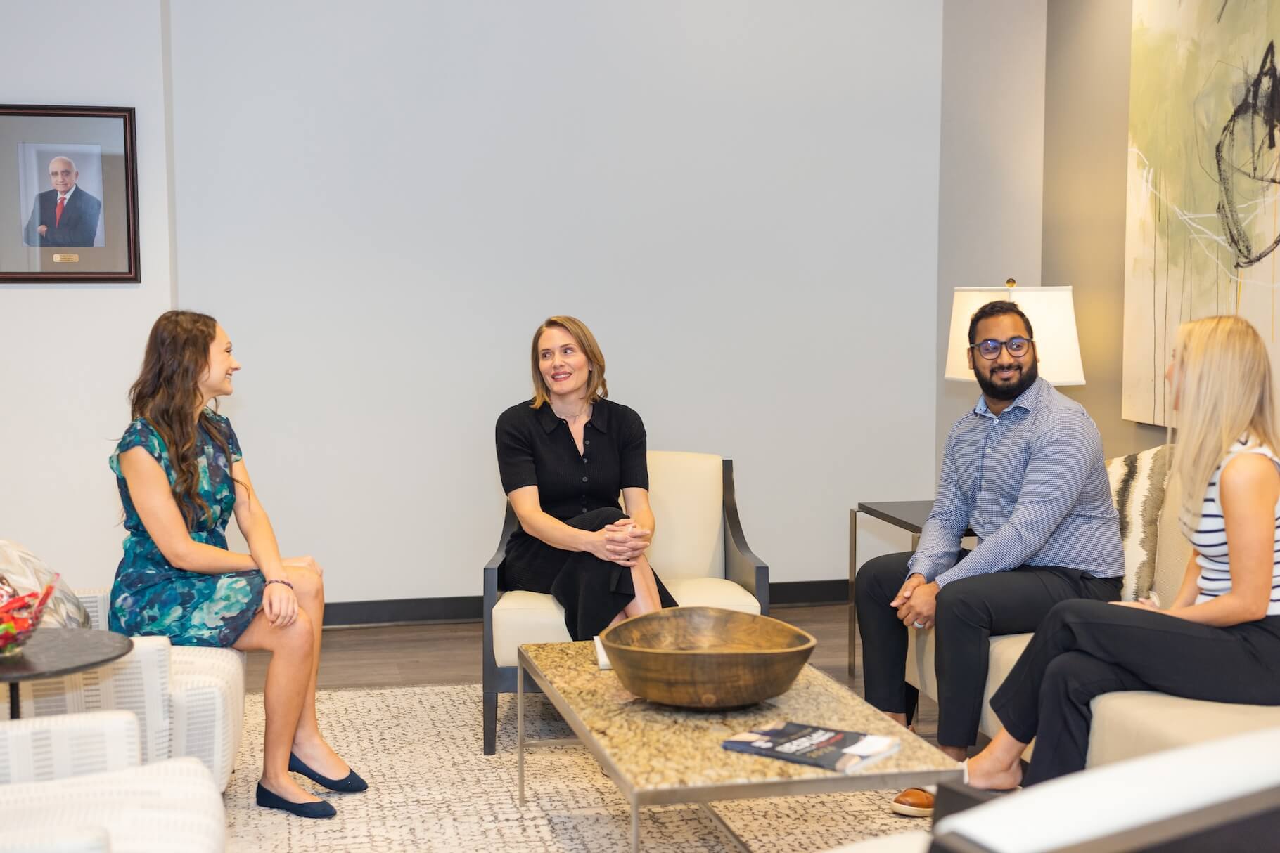 Stern Edlin Graham team members meeting in the office lounge