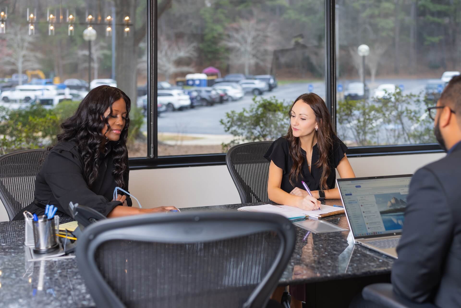 Stern Edlin Graham attorneys meeting with a client at a conference table